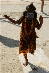 A child dressed up as the Hindu God Shiva poses for alms as pilgrims pass her by on the sandy riverbank. Shiva is popularly depicted with a greyish-blue skin palor & dressed in tiger skin. He is one of the three most influential denominations in Hinduism. The auspicious Maha Kumbh festival takes place once in 12 years and attracts the rich and poor alike.
Maha Kumbh Mela, Allahabad, India 2013: by capturedincameraobscura, Views[1296]