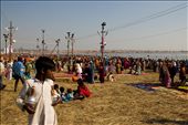 Standing in the middle of a rare clearing, a young lad looks at the crowded 'ghats' (riverbank) as millions of people throng the largest religious congregation in the world. Behind him the clear blue of a February sky is punctuated by lamposts running along the riverbank as the noon sun blazes on.
Maha Kumbh Mela, Allahabad, India 2013: by capturedincameraobscura, Views[370]