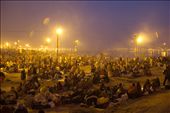 For some who have travelled on foot and by trains from across the country to undertake this holy journey, sleeping under the open sky with their luggage guarding them is the only option they can afford.
With an overflow of pilgrims at Kumbh 2013, the free rest homes for the poor filled up fast in the first few days. 
As night falls, the milling crowd settles down on the grounds, families cook & eat a simple meal while the men light a fire, huddle together and smoke a 'bidi' to warm themselves up: by capturedincameraobscura, Views[432]