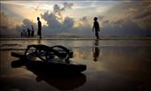 A visitor to the island takes off his slippers to step into the ocean: by capturerapture, Views[259]