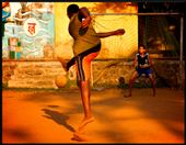 Local kids playing a game of football on a tiny school ground: by capturerapture, Views[217]
