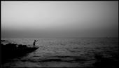 A fisherman throwing in his net to get the last catch of the day: by capturerapture, Views[205]