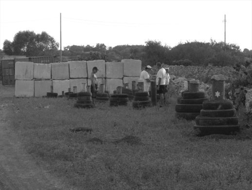 No it is not the Gaza strip, but the field from where one of the nicest fireworks shows on the island of Malta will take off within a few hours. This is the final inspection. Everything is ready. Concrete protection wall setup. Container at tha back containing petards to be loaded in the canon pipes during the show. And last but not least some manpower on the forefront going throu the final checks like length of cannon pipes and angle of fire depending on from where the wind is or will be blowing according to the weather report if any.