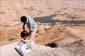A boy serve some tea to the tourist. He made a fire along the cliff of the canyon: by carlomure, Views[224]