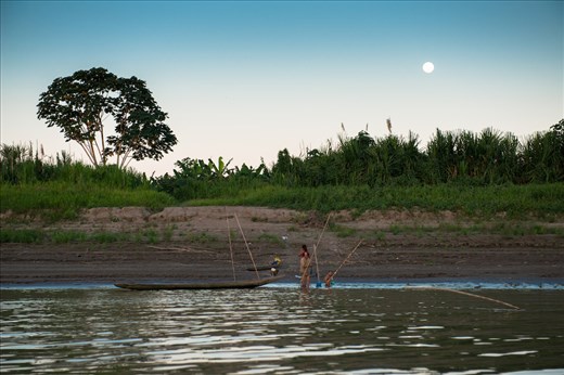 A family of Shipibo-Conibo indians washes up as the moon rises
