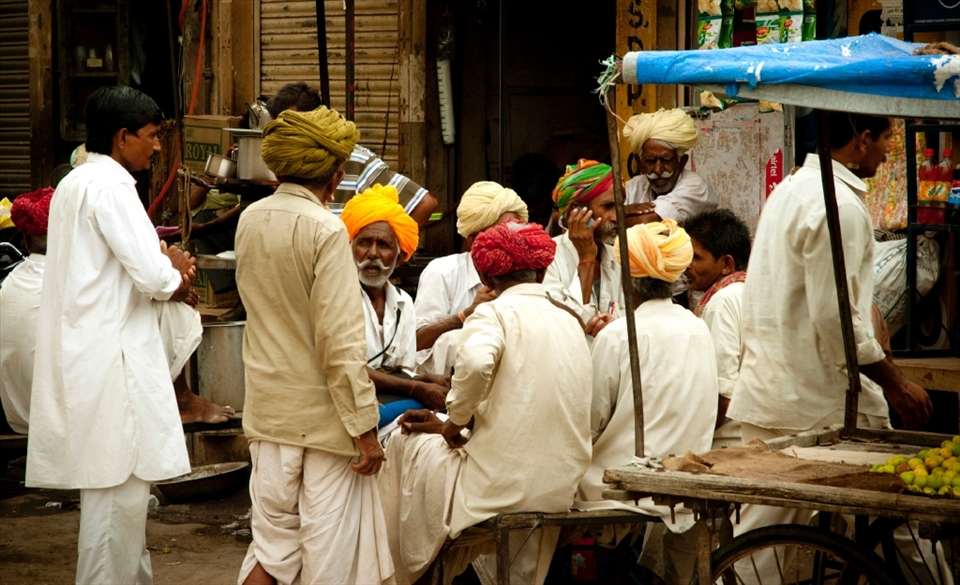 SOMETINHG WE DEFINE. People gather to talk divided by caste

