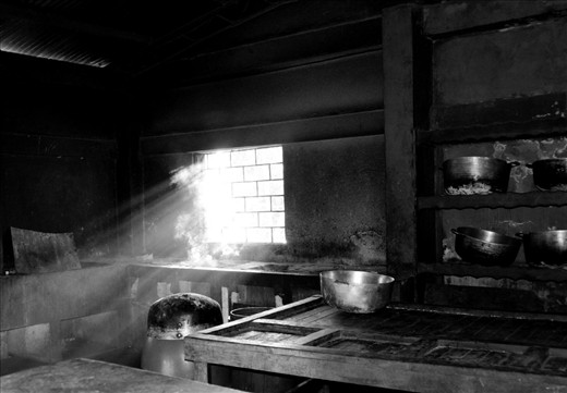 This photograph is part of the kitchen that is used to cook the orphans meals. Usually it's full of women preparing food, but i happen to catch it with just this beam of light coming in after lunch time.