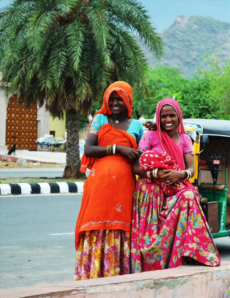 A young mother and mother-to-be smile broadly for the camera in bright saris.
Due to the acceleration in economic growth throughout the nation, an economic rift has appeared, with twenty-three per cent of the population sadly living below the poverty line.