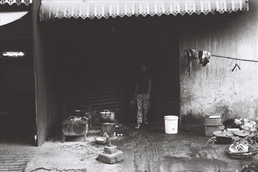 Clearing the path in anticipation of the day, she carries sleep in her eyes