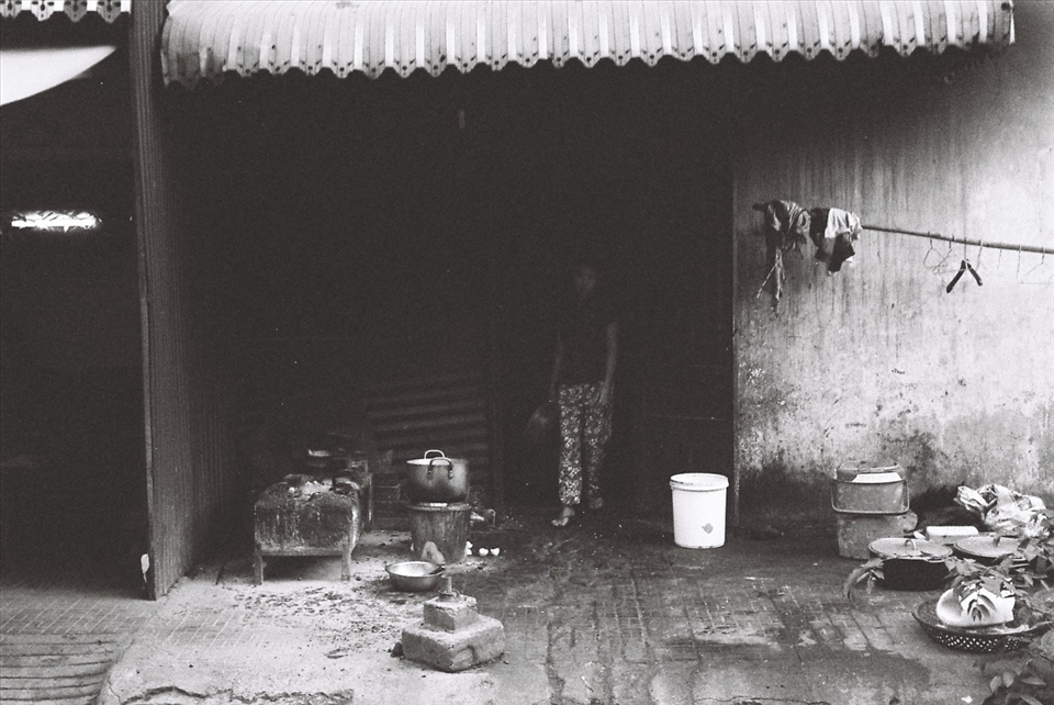 Clearing the path in anticipation of the day, she carries sleep in her eyes