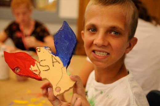 In the arts and crafts area, one proud American shows off his honor.