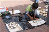 In Bogotá a boy strokes the final touches to his painting in hopes of a buyer.: by cbos, Views[270]
