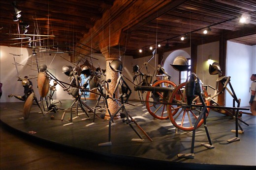 Depiction of battle using recovered weapons and armor of the time