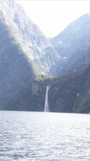 Waterfall on the opposite side of the fjord. On the way back we went right up to it. You can see where the glacier carved a previous valley that used to be the floor of the fjord at one time. 