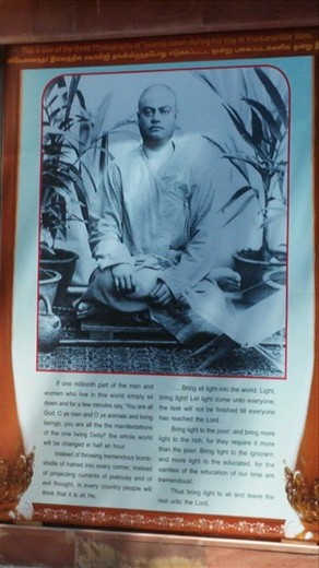 Poster of a monk on the outside of the temple with some lovely writing