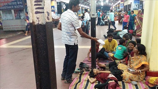 Another family waiting at the train station. They come prepared, with blankets and food. This is very commonplace.