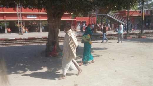 Colorful Indian outfits at a train station.