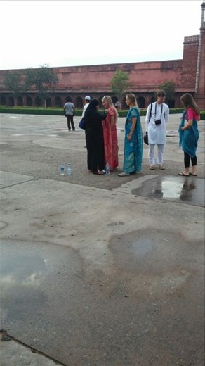 Tourists getting assistance with their saris 