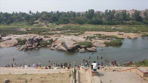 Tourists bathing in the river before going to temple
