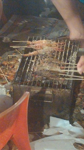 Grilling up the crawfish the patrons caught. 