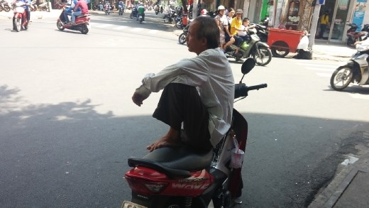 Moto taxi - waiting on the corner for a fare
