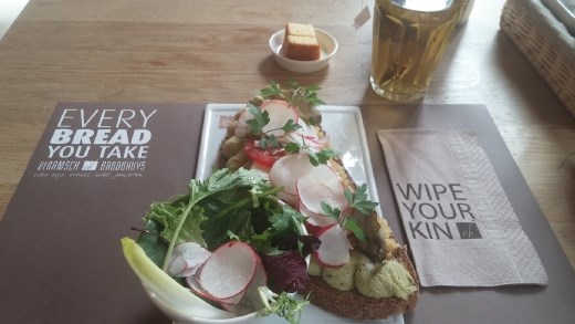 Lunch at a brown cafe. Open-faced Brown bread sandwich and tea.