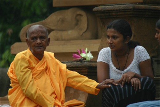 A bhikkuni engrossed in a conversation 