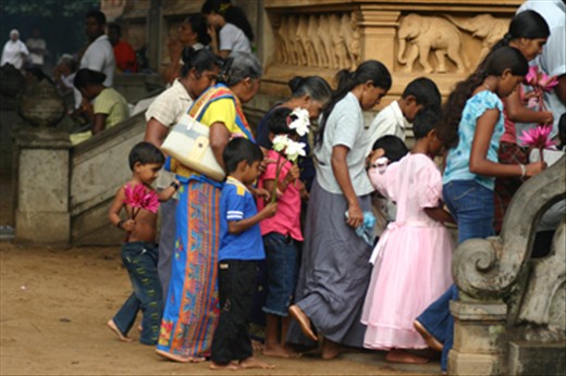 Pilgrims line up to make offerings to the shrine
