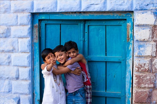These young boys will probably never remember me, but what I wouldn't give to be able to go back in 10 years and take a picture of them against this blue door. 
Their warmth & joie de vivre is there for all to see, and so is their resolve to make their dreams come true.