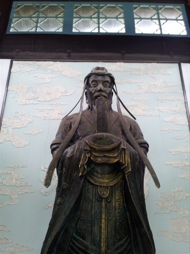 From jia xing. He is the mythical god like man who created the Chinese language. I think his name was can jie/ji (yep sounds like kanji)
Note his 4 eyes denoting intelligence and academia merit I suppose