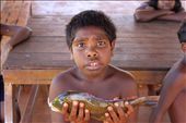 I love taking pictures of people   and capturing emotions. For me this picture resembles a level of innocence and confusion after we gave this kid one of our catches. Cameras weren't something these kids were used to.: by chanti, Views[455]