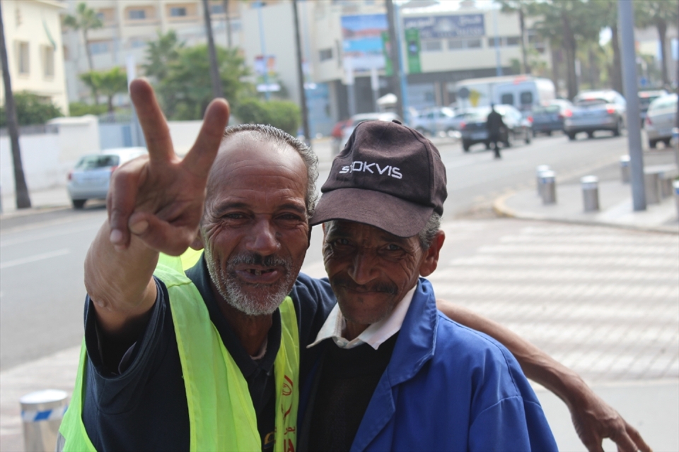 A parking guy and a cigarette seller enjoying the moment being in the third eye, Happy smile in both faces...I call it Happy poverty 