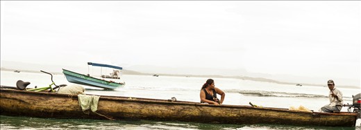 In the Mouth of the Bull, many indigenous families travel in dugout canoes.