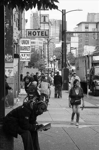 The Downtown East-side (DTES) neighborhood is the dark and seedy side of beautiful, flashy Vancouver, Canada.  Centered around the above pictured East Hastings street, it is commonly reported to be the poorest area in the entire country.  Demographics show that it is plagued with the highest incidences of poverty, addiction, violence, crime, sex trade, homelessness, unemployment, mental illness and HIV and Hep C infection rates.