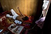 I met him in the the Boeng Kak slum area of Phnom Penh.  A mutual friend suggested I meet this highly respected traditional healer and get a talisman to protect me on the journey back home.  When I walked into his home I was startled by the contrast between my expectations and my reality.  There laying before me cachectic, ill and hooked up to a lipid IV infusion was this revered healer my friend had told me about.  : by chasethelight, Views[856]