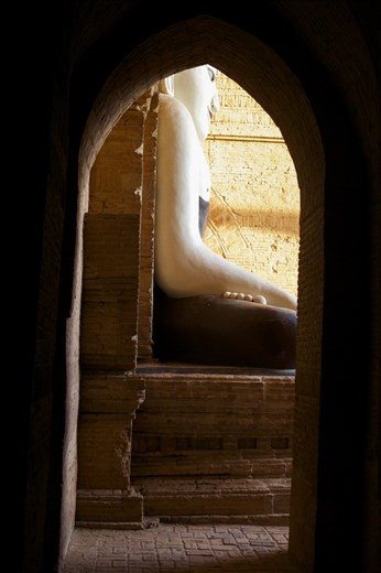 One of the Buddha statures in a temple at Bagan, bathed in early morning light.