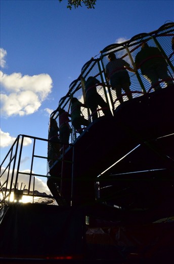 Carnival: this image was captured from the back of the ride of people engaging in fun. 
The light was also changing which hightened the sense of fantasy.