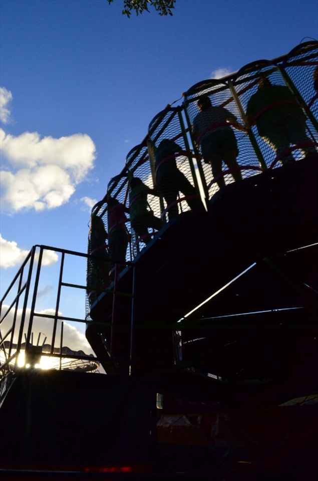 Carnival: this image was captured from the back of the ride of people engaging in fun. 
The light was also changing which hightened the sense of fantasy.