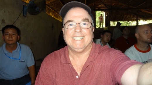 I just found out this camera takes shots if you just smile!  No buttons to press.  The guy behind me doesn't seem all of that impressed.