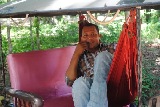 Hung, my private tuk tuk driver all day.  Taking a nap in his hammock waiting for me to finish.