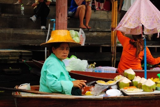 Floating market...this vendor giving Queen Elizabeth competition with her hat.