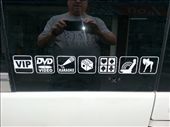 Decal on VIP bus door.  I figured out all except the last one...Zumba dancing allowed?: by chicagoguy, Views[257]