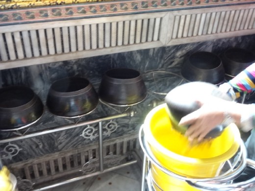 Collecting the coins put in the 108 jars