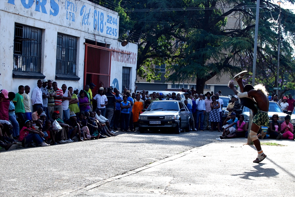 A Zulu dancer demonstrating Mzansi style dancing on a Sunday afternoon 