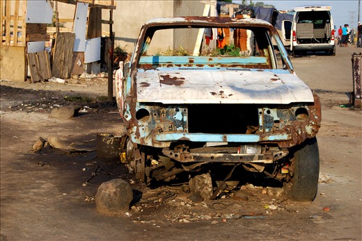 A car in the squattercamp outside a Zulu migrant hostel