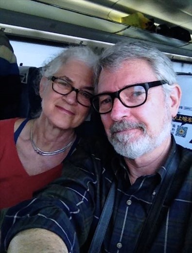 Happy Couple on train going 300 km/hr
