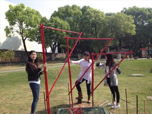 Girls installing the pieces