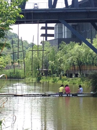 hanging piece in place, 3 girls playing