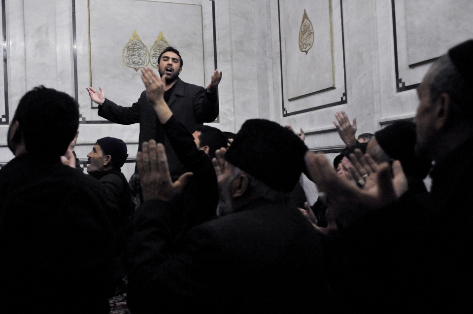 Shiite pilgrims mourning for Imam Hussein. Shrine of Hussein, Umayyad Mosque, Damascus, Syria.