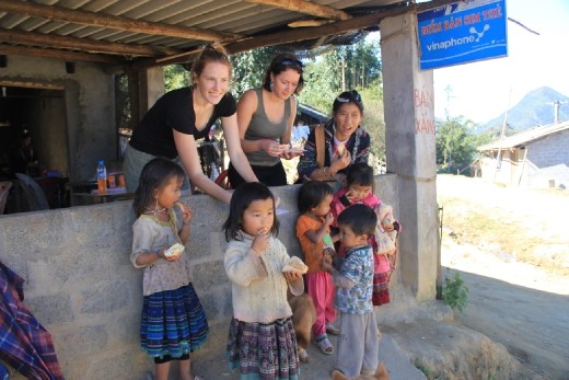 Giving children our leftover bread.  They are well fed but mainly eat rice, bread is a treat for them.